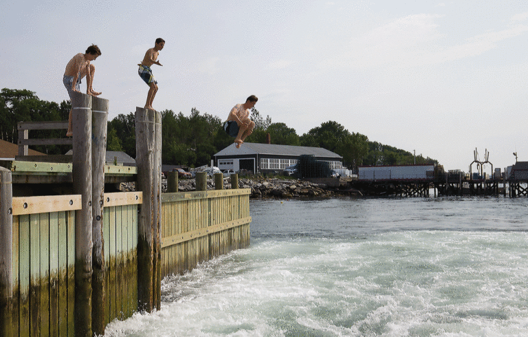 Dock jumping is a favorite summer activity on Long Island.