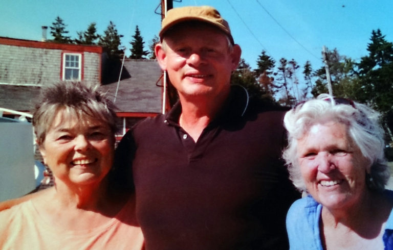 Actor Martin Clunes of the TV show Doc Martin is flanked by Mikki Ames