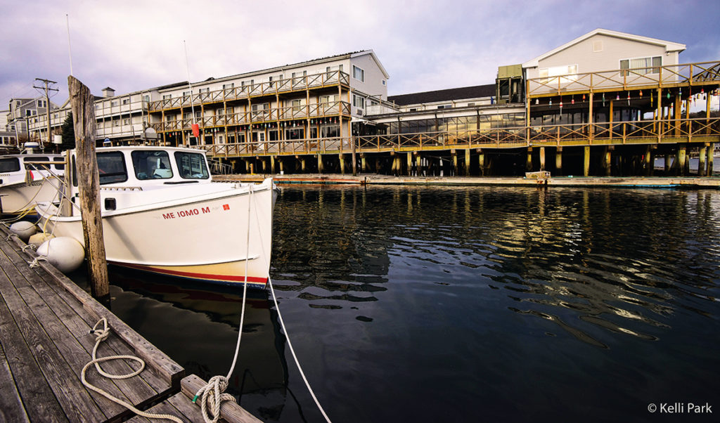 Mixed use or conflicting uses? An early winter scene in Boothbay Harbor captures the fishing industry’s presence along with nearby tourism-related buildings.