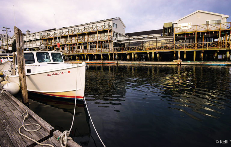 Mixed use or conflicting uses? An early winter scene in Boothbay Harbor captures the fishing industry’s presence along with nearby tourism-related buildings.