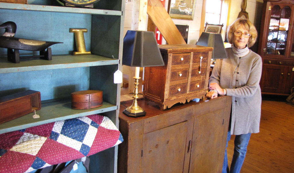 Phyllis Sommer poses at her Searsport shop