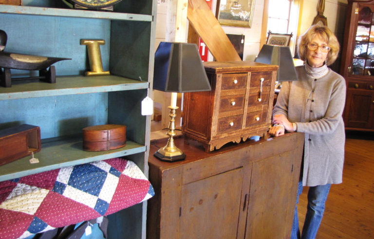 Phyllis Sommer poses at her Searsport shop