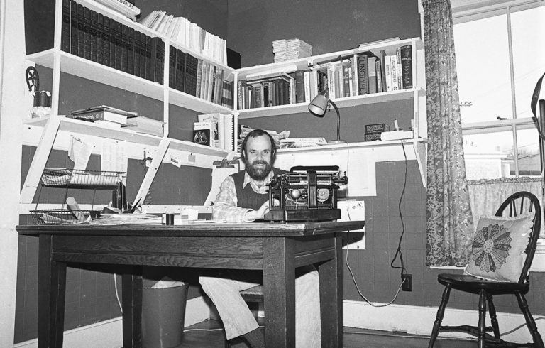 Island Ad-Vantages publisher and editor Nat Barrows at his typewriter in the early years.