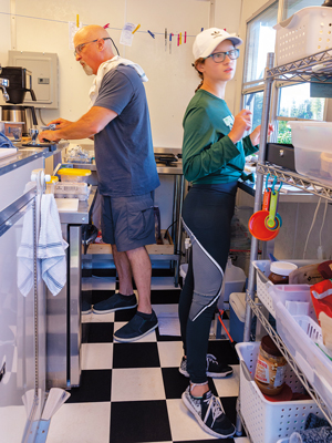 Gary and Meri Rainford work in the kitchen.