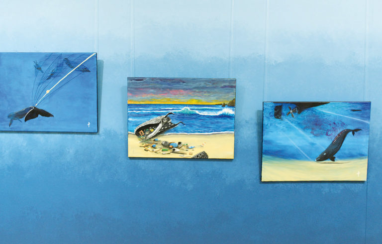 Nicholas Paul’s paintings depict how whales are killed.