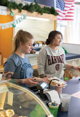 Sophia Morin, left,and Myisha Cutler at work in Reilly’s Bakery. 