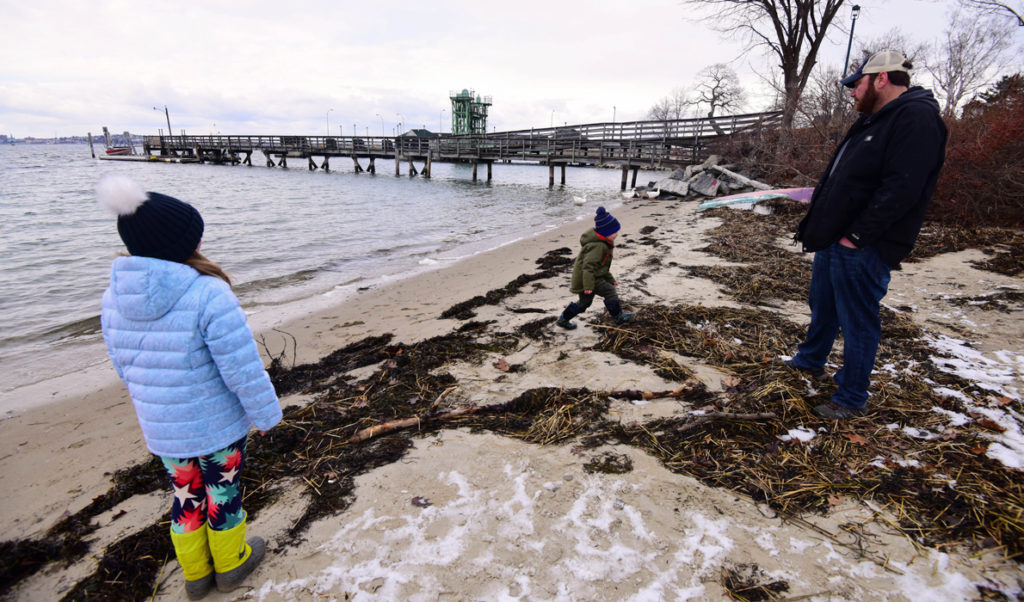 Tom Werner and his children on the Peaks Island shore