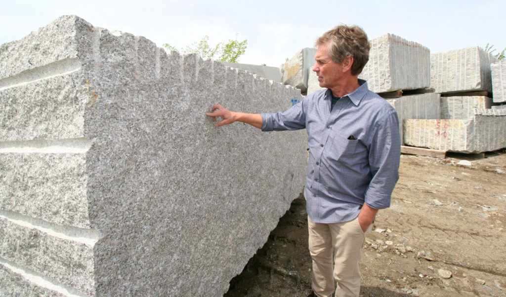 Jeff Gammelin points out the qualities of the granite.