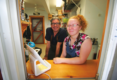 Hitty’s Café owner Cezar Ferreira with employee Amber Walls. 