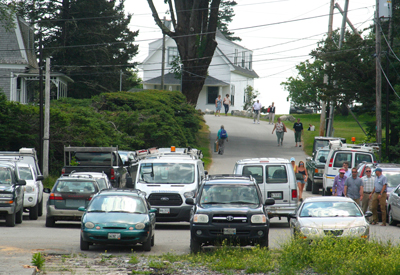 A group walks to the town landing.