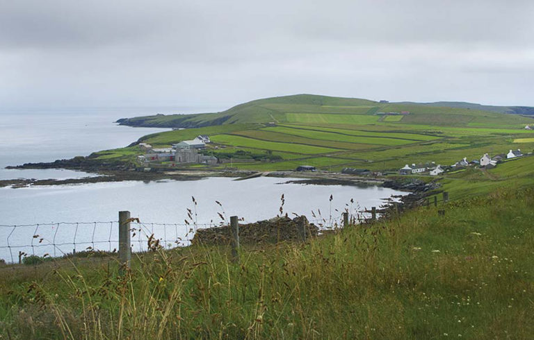 A scenic view of an island off Scotland.