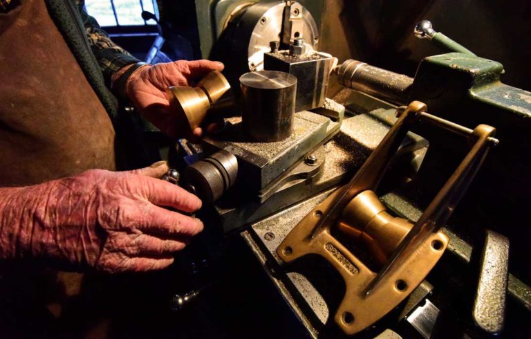 The hands of Skip Collins at Spartan Marine.