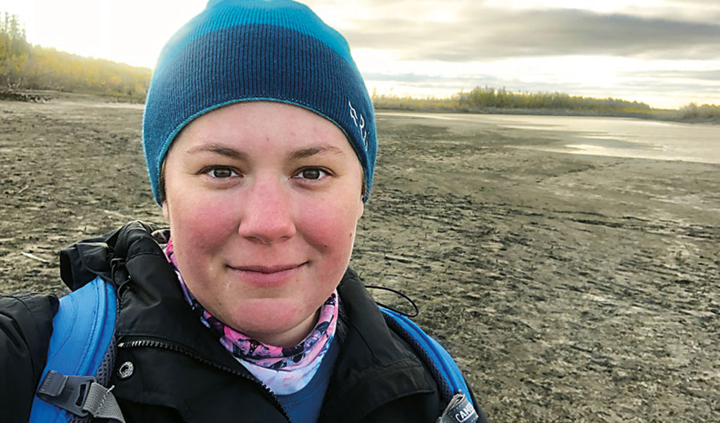 Jacquelyn Gill stands near the Indigirka River