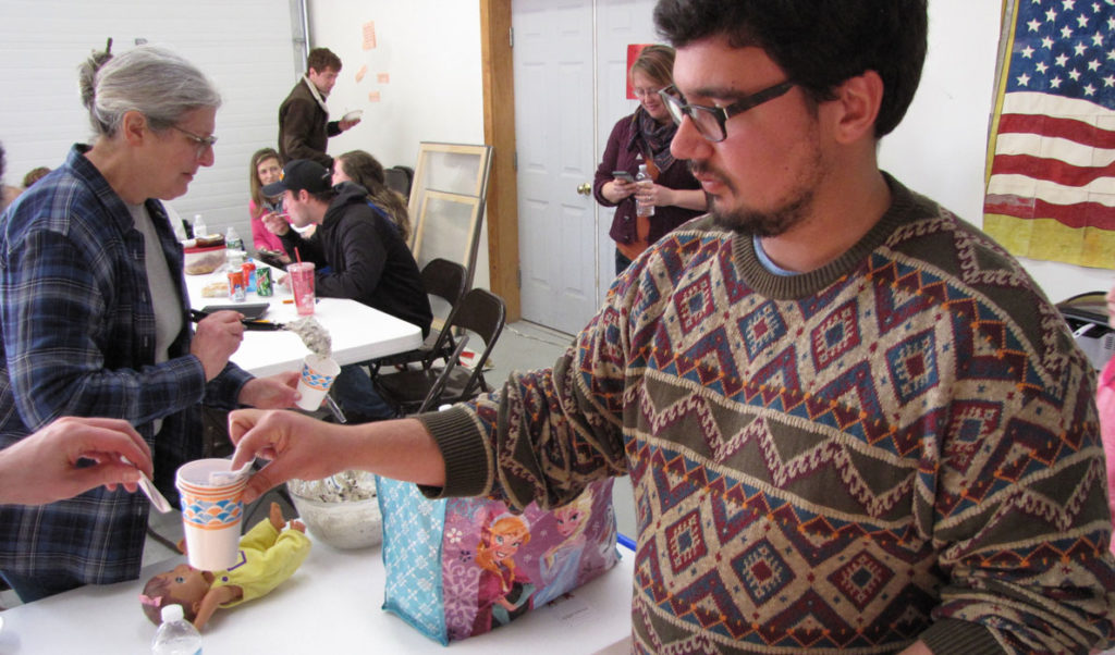 Zain Padamsee collects ballots at a recent chili cook-off event on Frenchboro.