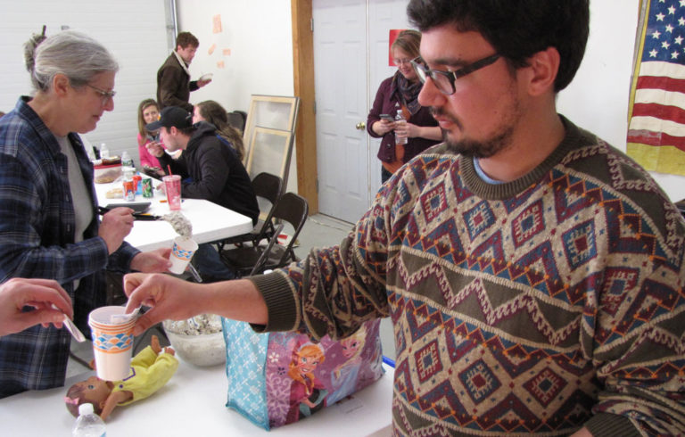 Zain Padamsee collects ballots at a recent chili cook-off event on Frenchboro.