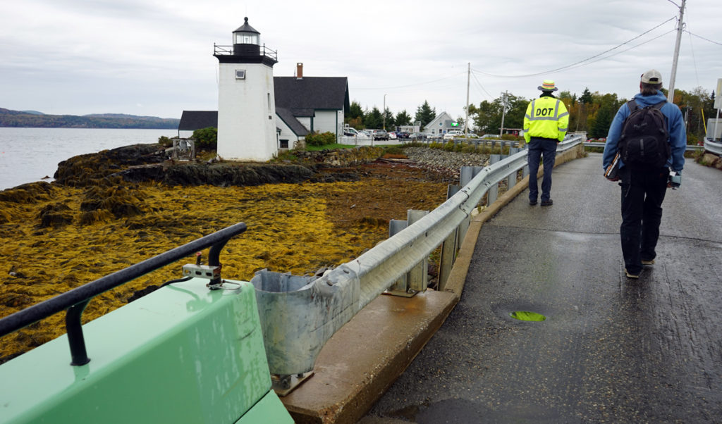 A crew member and passenger walk off the ferry to Islesboro.