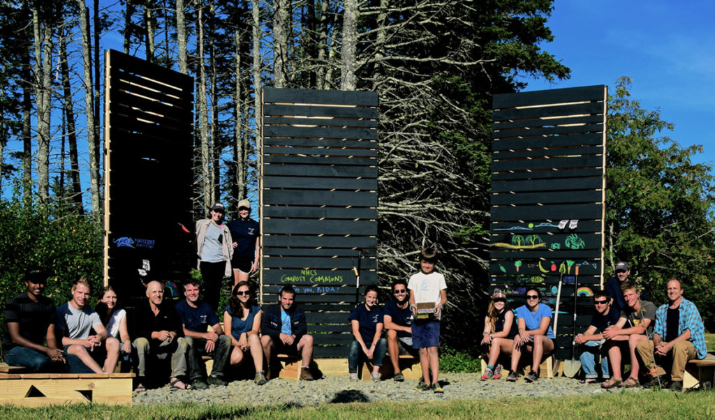 The team chalks pictures on the composting towers