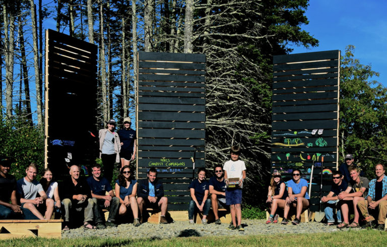 The team chalks pictures on the composting towers