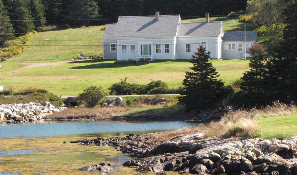 An older Cape Cod house on Isle au Haut's shore.