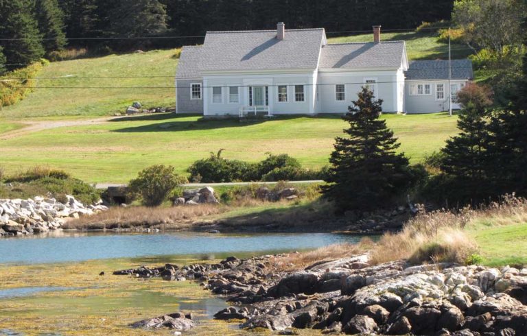 An older Cape Cod house on Isle au Haut's shore.