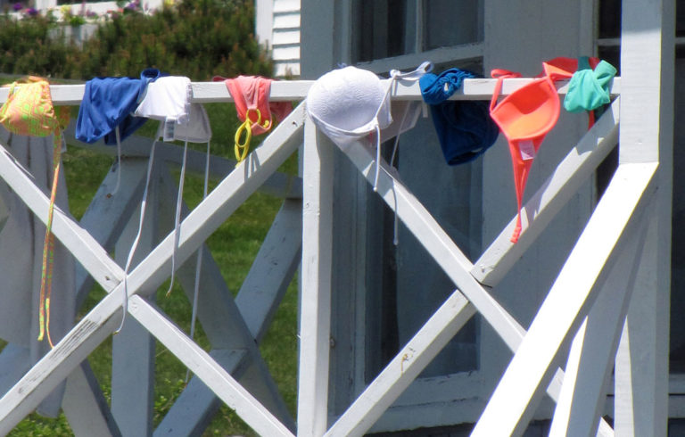 Bathing suits of the modest variety dry in the sun on Peaks Island.