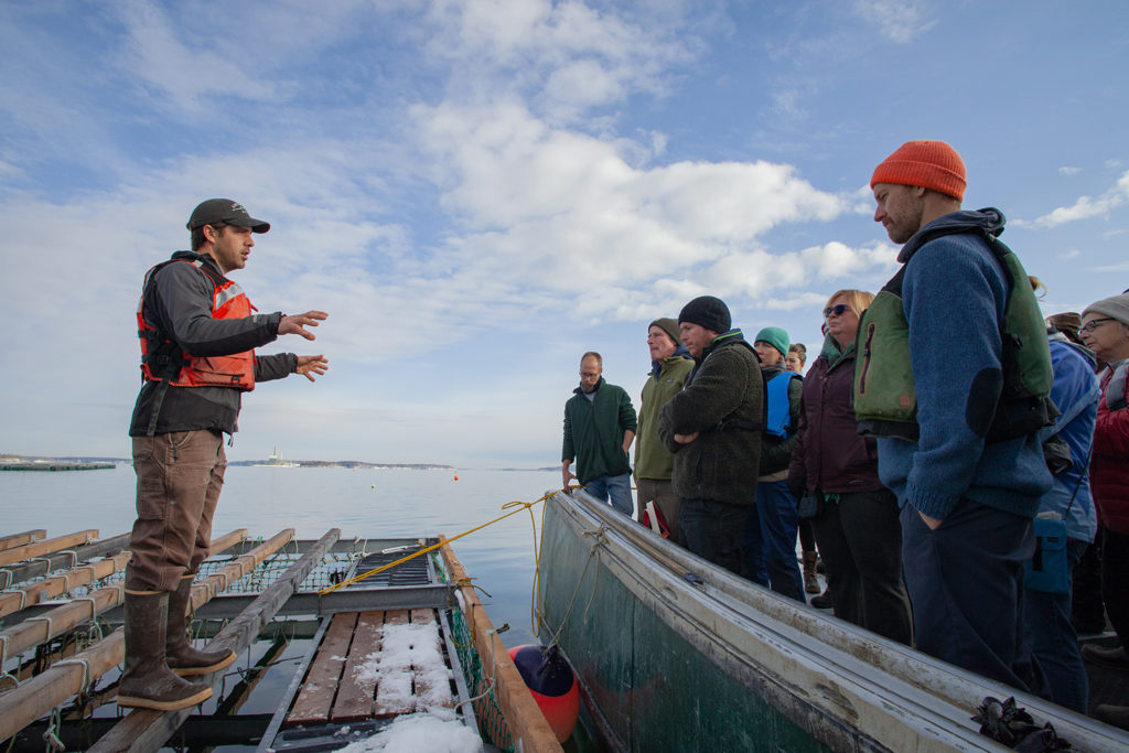 Matt Moretti (left) from Bangs Island Mussels takes ABD participants on a tour of his farm operations during the group’s annual Industry Day event in December.
