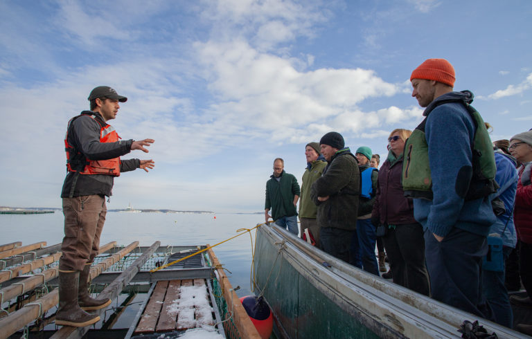 Matt Moretti (left) from Bangs Island Mussels takes ABD participants on a tour of his farm operations during the group’s annual Industry Day event in December.