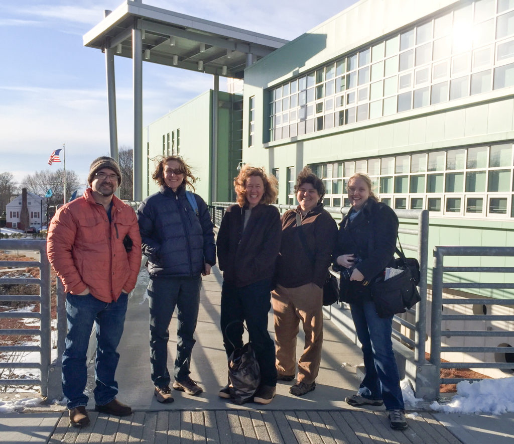 The group in front of the Marine Science Magnet High School of Southeastern CT in Groton