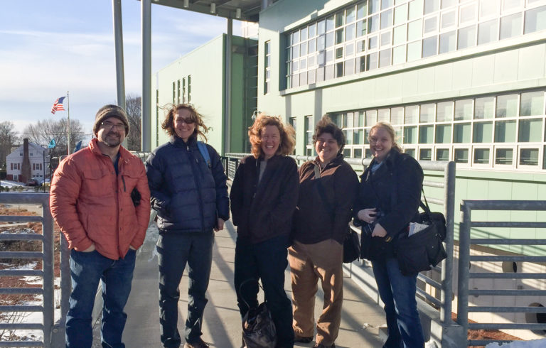 The group in front of the Marine Science Magnet High School of Southeastern CT in Groton