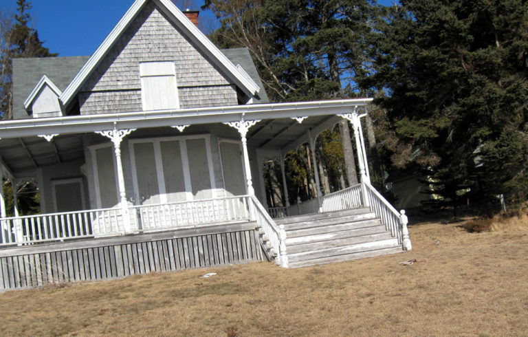 A house on Hancock Point boarded up for winter.