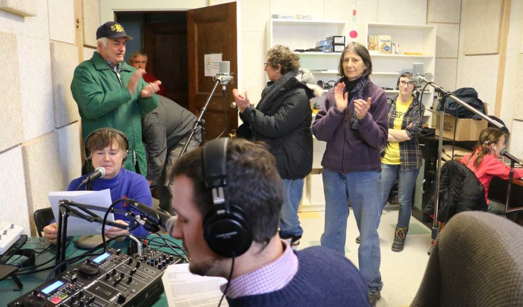 Volunteers and supporters celebrate WBFY/100.9 FM going on-air.