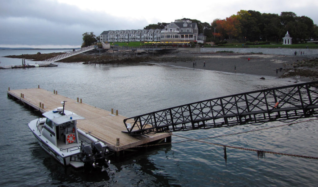 The Bar Harbor Inn at center on a cloudy autumn day.