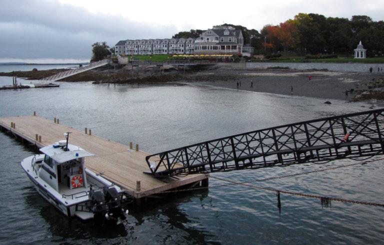 The Bar Harbor Inn at center on a cloudy autumn day.