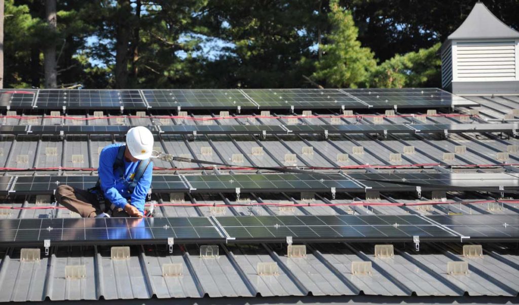 Cal Trumann of ReVision Energy installs photovoltaics.