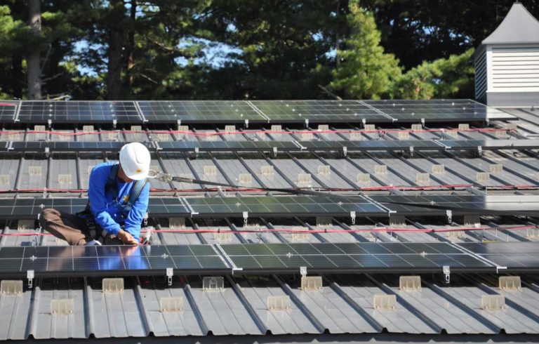 Cal Trumann of ReVision Energy installs photovoltaics.