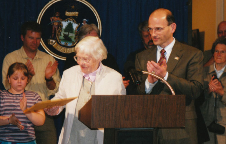 Mabel Knowles Doughty with Gov. John Baldacci when the bill creating the town of Chebeague Island was signed.