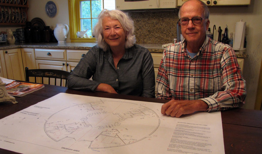 Nancy and W.G. Sayre with blueprints for the new childcare center.