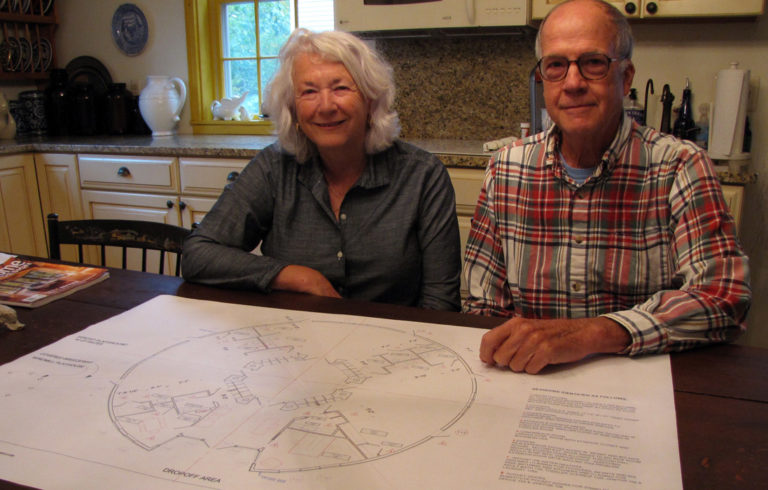 Nancy and W.G. Sayre with blueprints for the new childcare center.