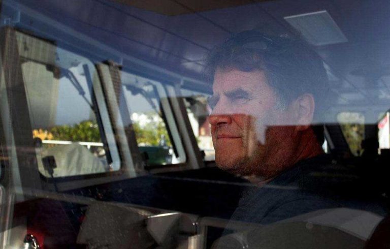 Peter Willcox in the wheelhouse of a Greenpeace ship.