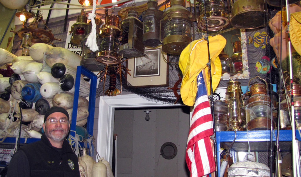 Jim Harkins among his store of nautical gear.