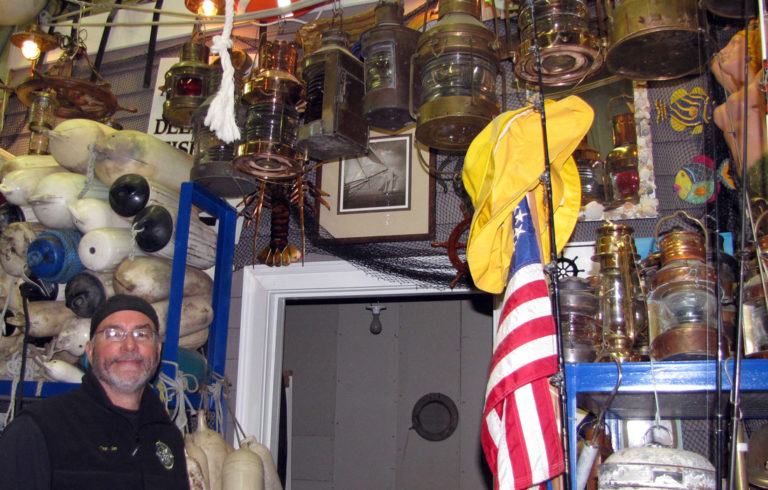 Jim Harkins among his store of nautical gear.