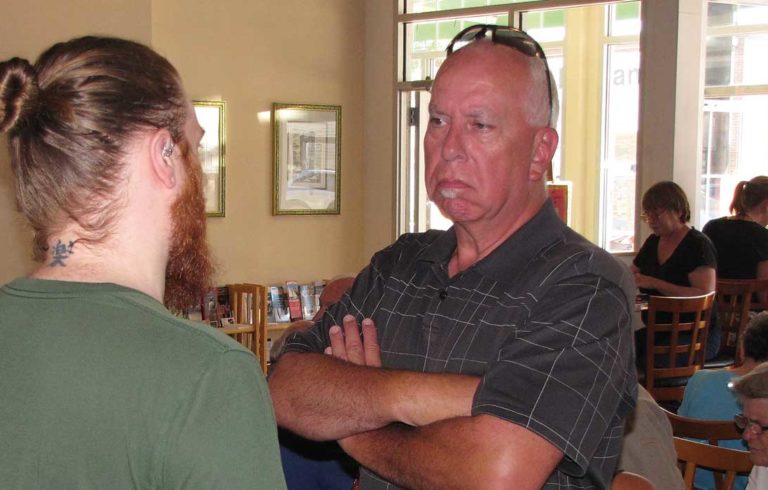 Gordon Page chats with the manager of Rock City Café.