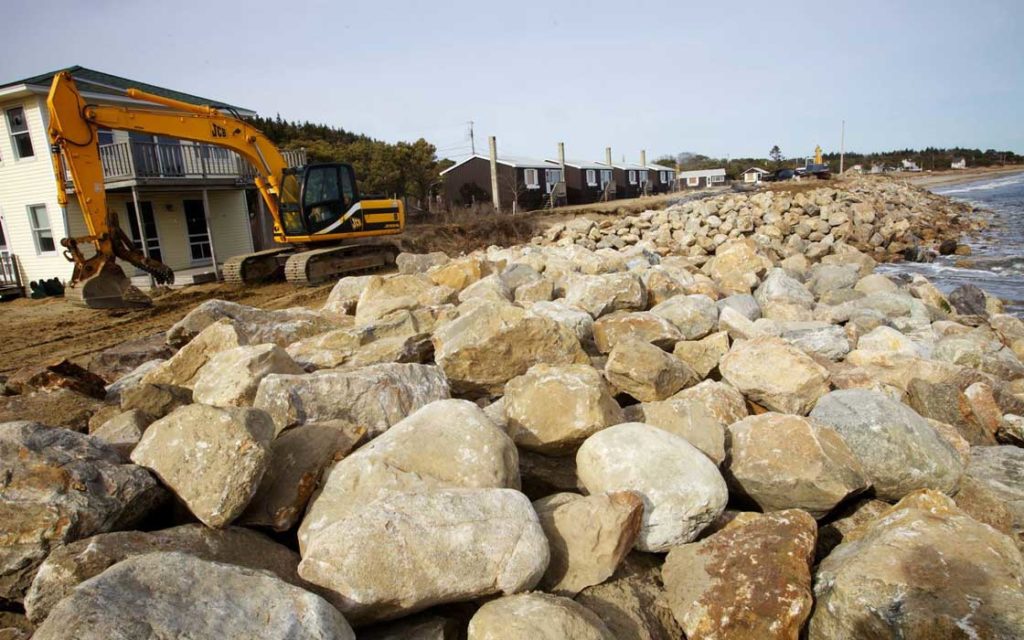 A seawall is built at Popham Beach in Phippsburg in March 2013 to protect homes from the sea.