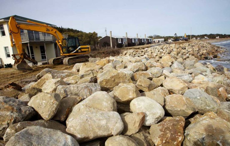 A seawall is built at Popham Beach in Phippsburg in March 2013 to protect homes from the sea.