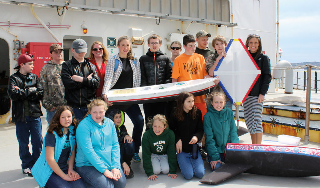 Swan's Island students on the deck of the State of Maine with their boat