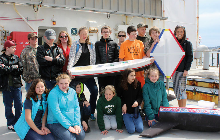 Swan's Island students on the deck of the State of Maine with their boat