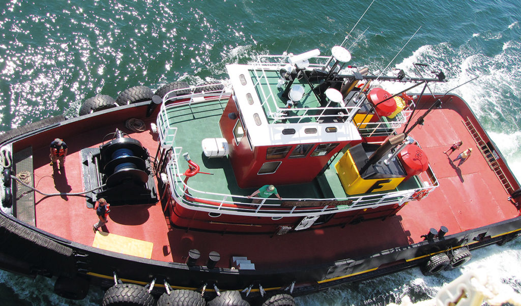 One of Fournier's tugs works alongside Maine Maritime Academy's State of Maine last summer.