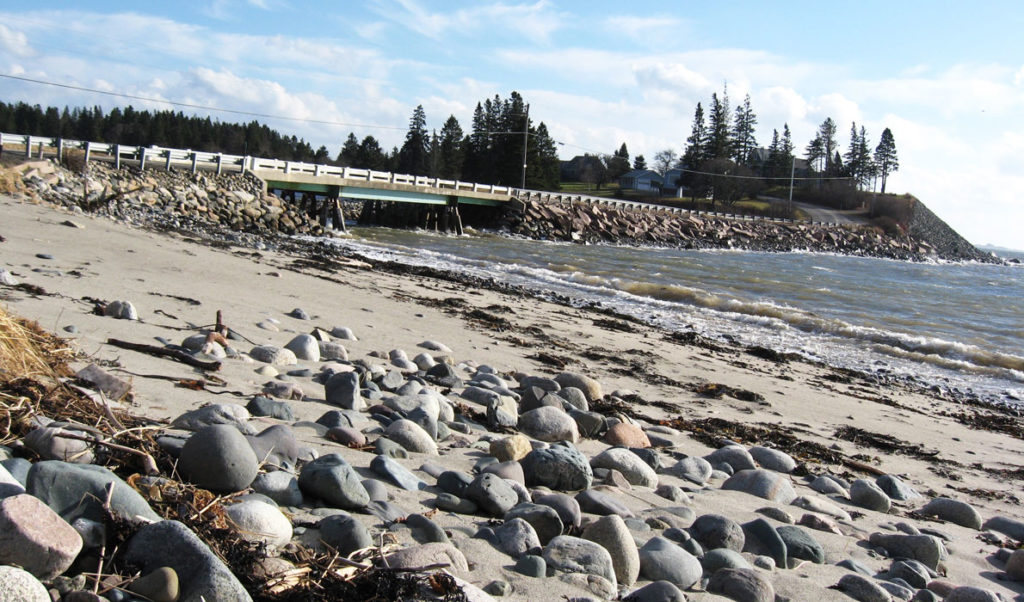 Waves break on the shore at Roque Bluffs