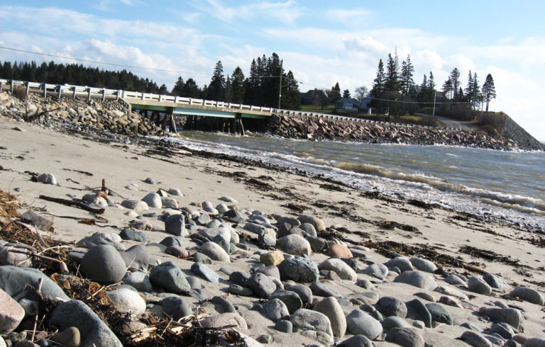 Waves break on the shore at Roque Bluffs