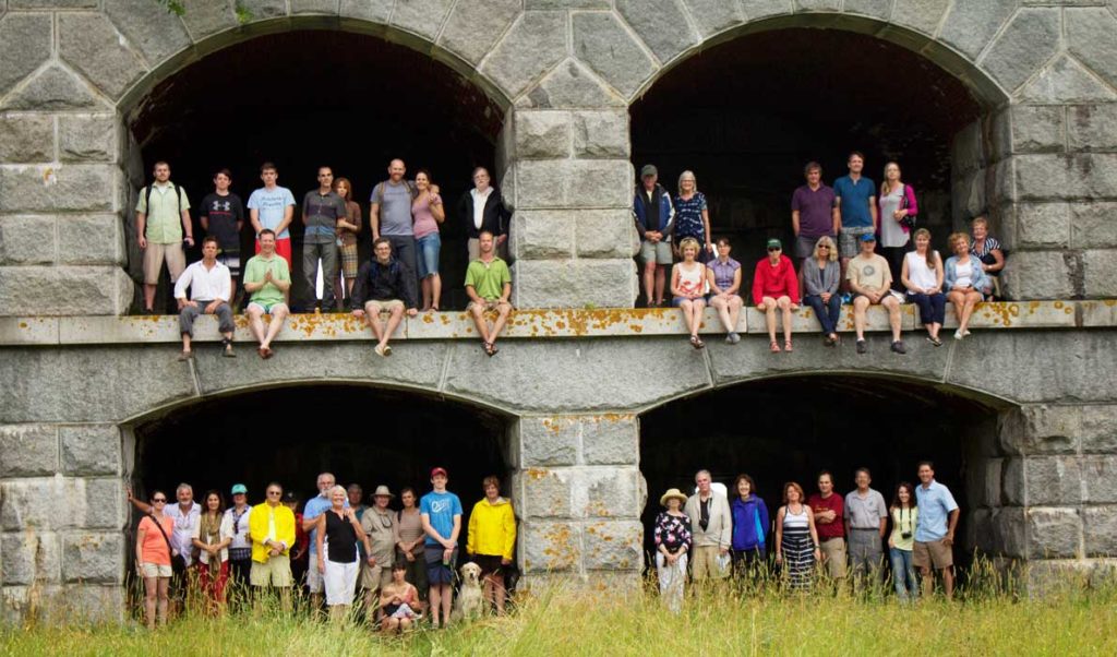 Members of the Friends of Fort Gorges and volunteers gather for a group photo.